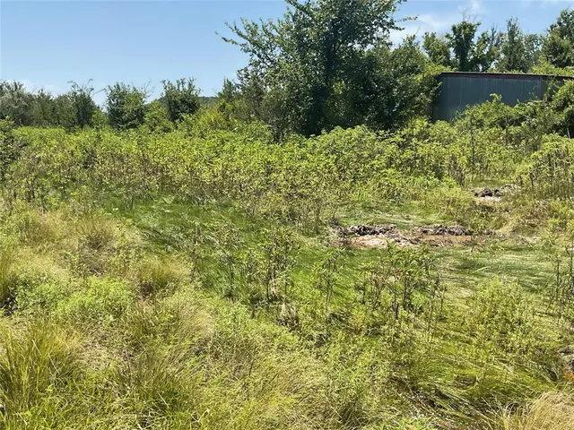 a view of a lake with top of house