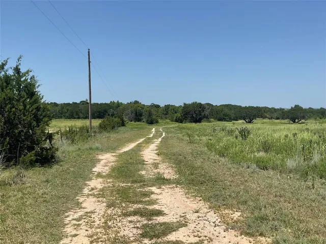 a view of a water fountain and a yard