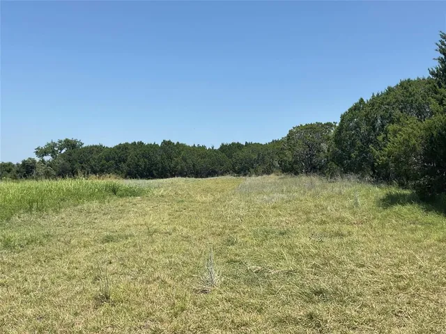 a view of lake with mountain in background