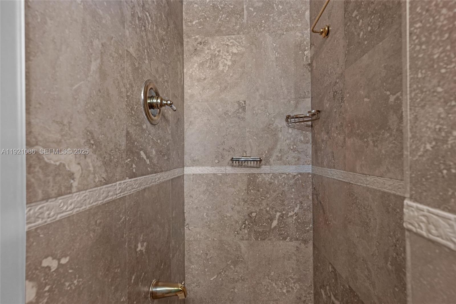 9400 Southwest 193rd Drive, Unit 9400 Cutler Bay, FL 33157 - Photo 16 of 42 a bathroom with a shower