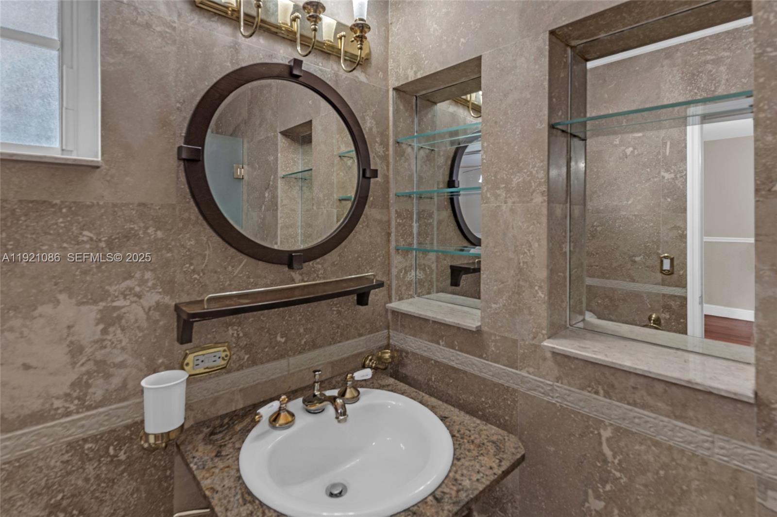 9400 Southwest 193rd Drive, Unit 9400 Cutler Bay, FL 33157 - Photo 17 of 42 a bathroom with a sink and a mirror