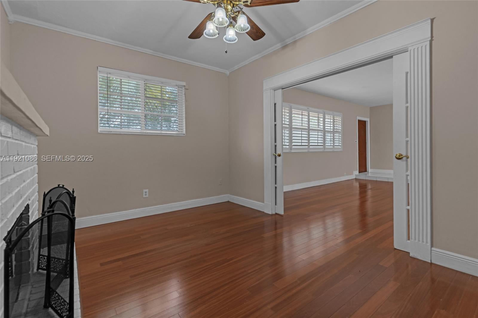 9400 Southwest 193rd Drive, Unit 9400 Cutler Bay, FL 33157 - Photo 24 of 42 wooden floor in an empty room with a window