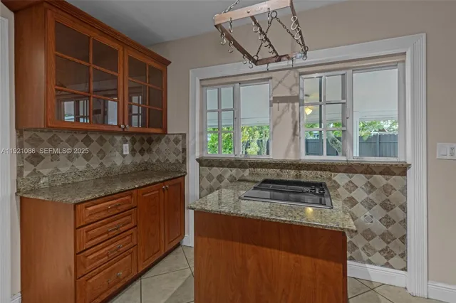 a kitchen with a stove and a sink