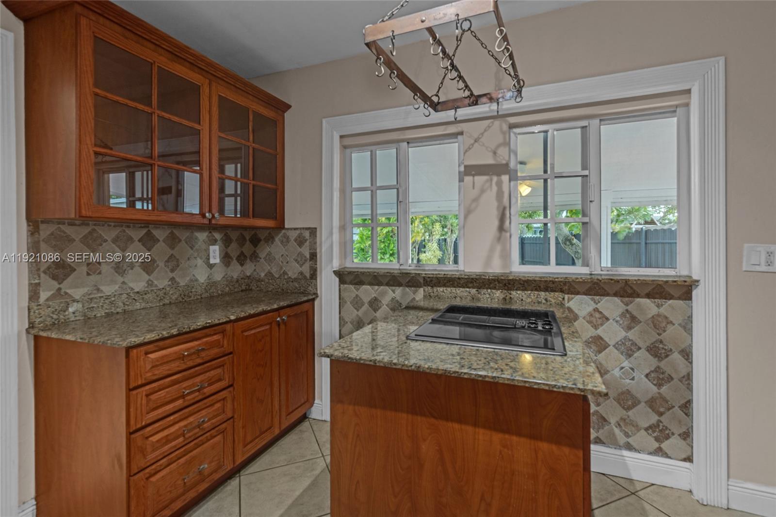 9400 Southwest 193rd Drive, Unit 9400 Cutler Bay, FL 33157 - Photo 30 of 42 a kitchen with a stove and a sink
