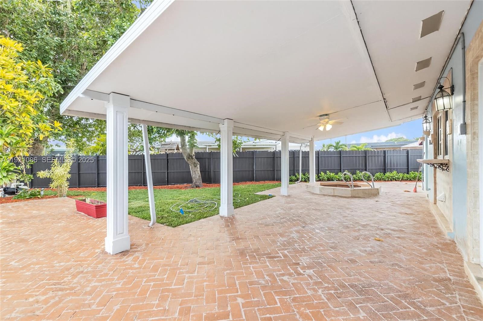 9400 Southwest 193rd Drive, Unit 9400 Cutler Bay, FL 33157 - Photo 37 of 42 a view of a house with backyard and porch