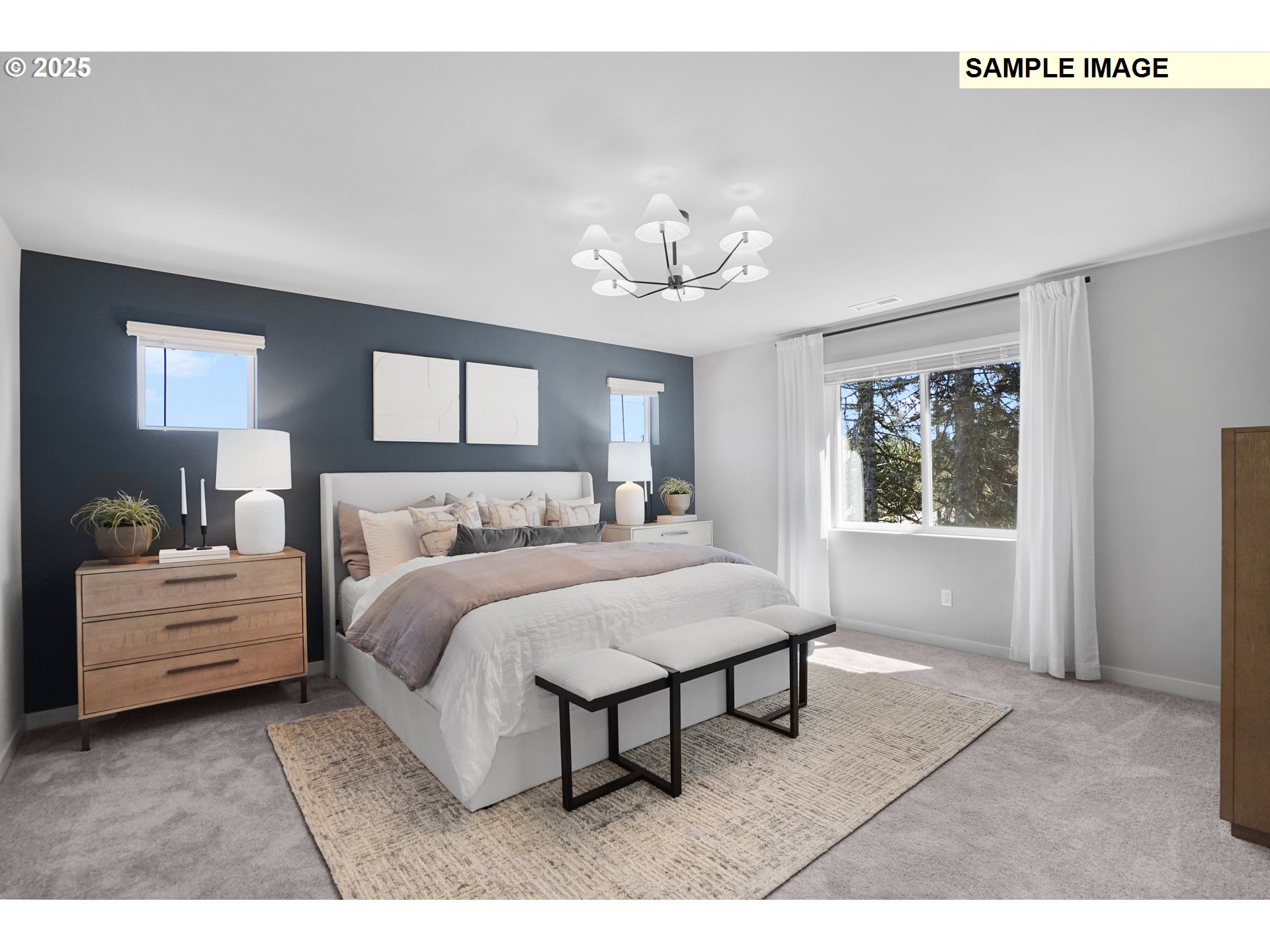 33370 Southwest Rokin Way Scappoose, OR 97056 - Photo 10 of 32 a spacious bedroom with a bed and a chandelier