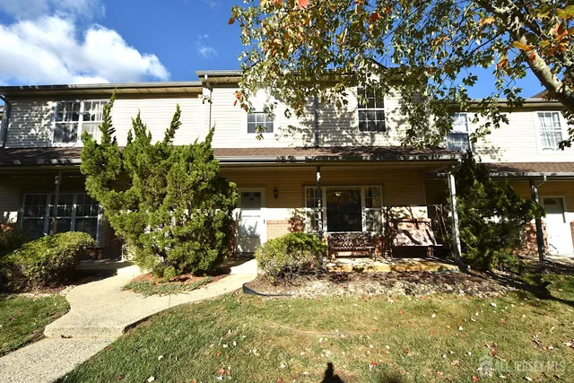 a view of a house with a yard