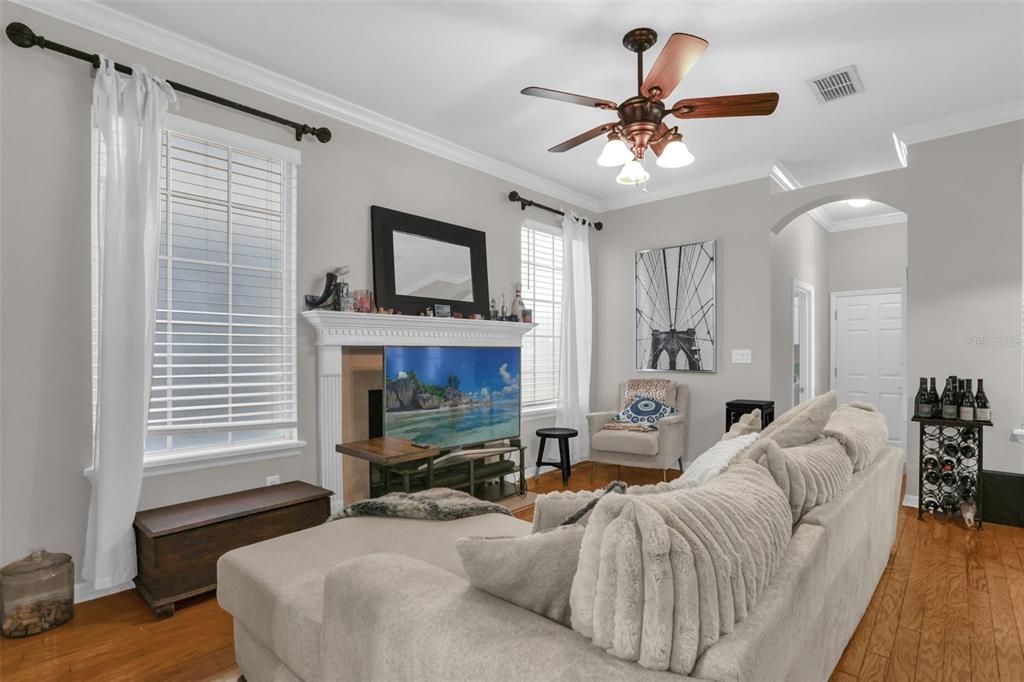 2165 Ridgewood Street Orlando, FL 32803 - Photo 3 of 37 a living room with furniture a fireplace and a window