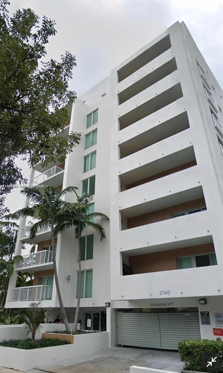 2740 Southwest 28th Terrace, Unit 503 Miami, FL 33133 - Photo 1 of 19 a view of a tall building with many windows