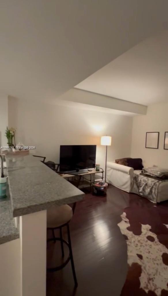 2740 Southwest 28th Terrace, Unit 503 Miami, FL 33133 - Photo 3 of 19 a living room with furniture and flat screen tv
