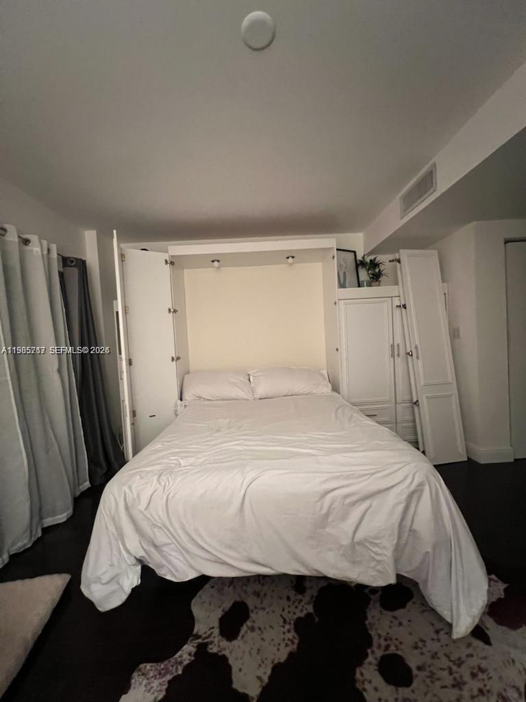 2740 Southwest 28th Terrace, Unit 503 Miami, FL 33133 - Photo 6 of 19 a bedroom with a bed and a window