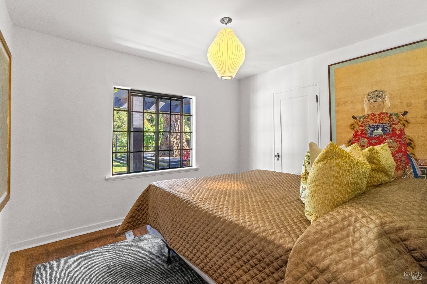 93 Cascade Drive Fairfax, CA 94930 - Photo 13 of 61 a bedroom with a bed and a window