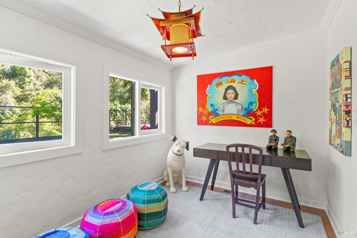 93 Cascade Drive Fairfax, CA 94930 - Photo 23 of 61 a bedroom with a bed and a chair