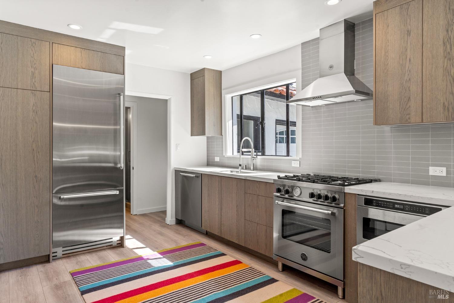 93 Cascade Drive Fairfax, CA 94930 - Photo 29 of 61 a kitchen with stainless steel appliances a stove a sink and a refrigerator