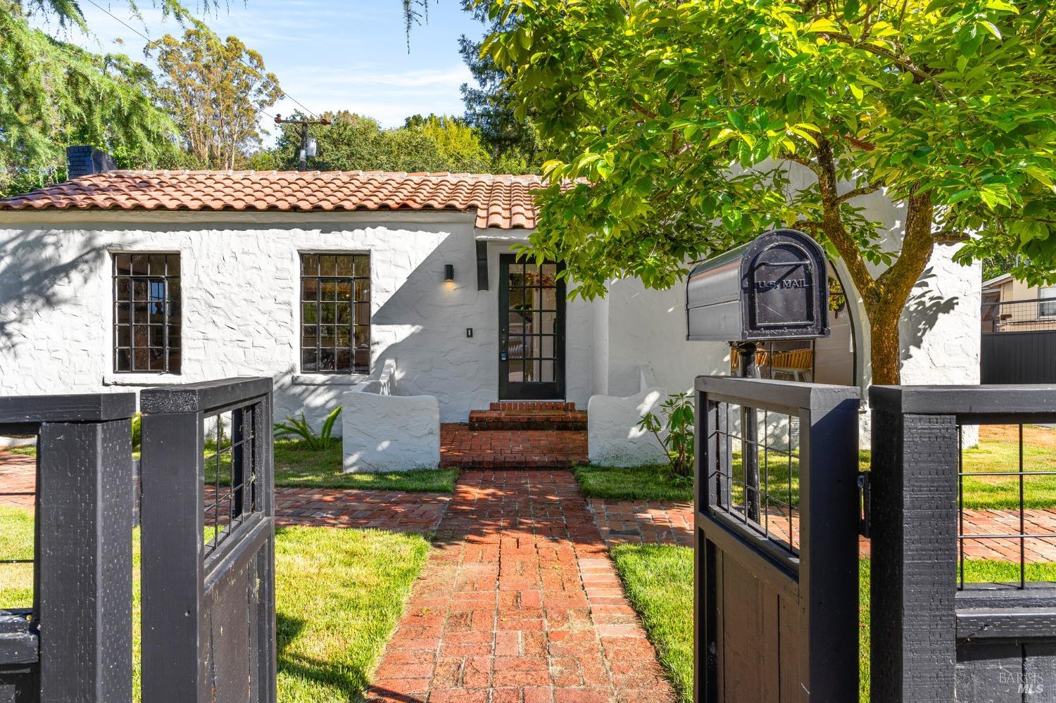 93 Cascade Drive Fairfax, CA 94930 - Photo 4 of 61 a front view of a house with a garden