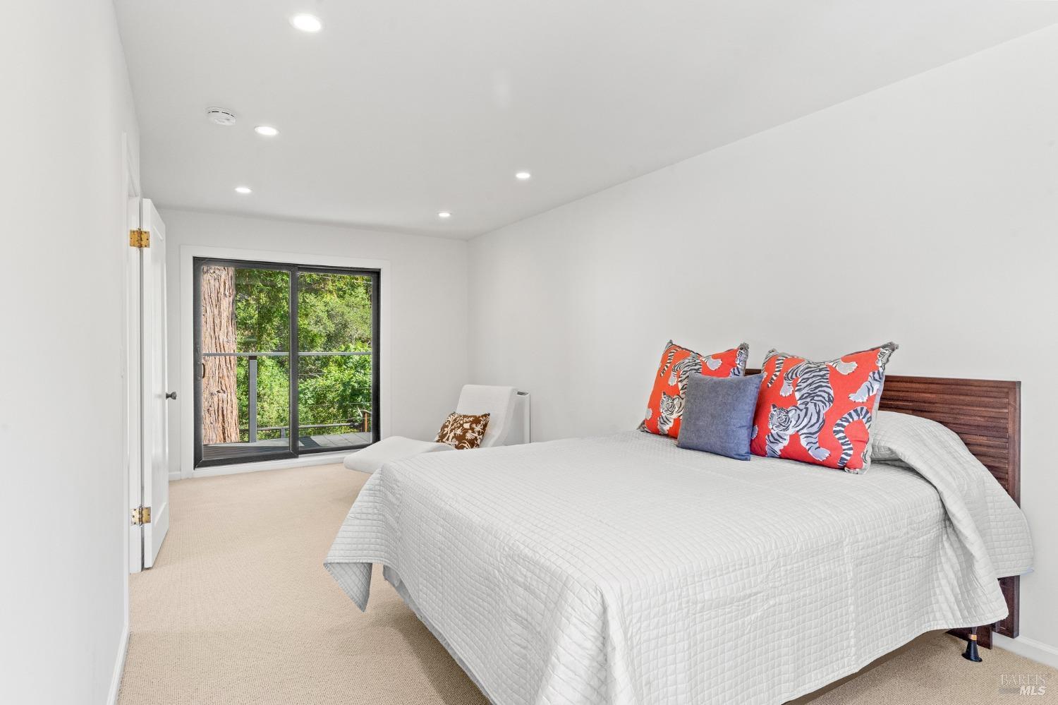 93 Cascade Drive Fairfax, CA 94930 - Photo 44 of 61 a bedroom with a large bed and a large window