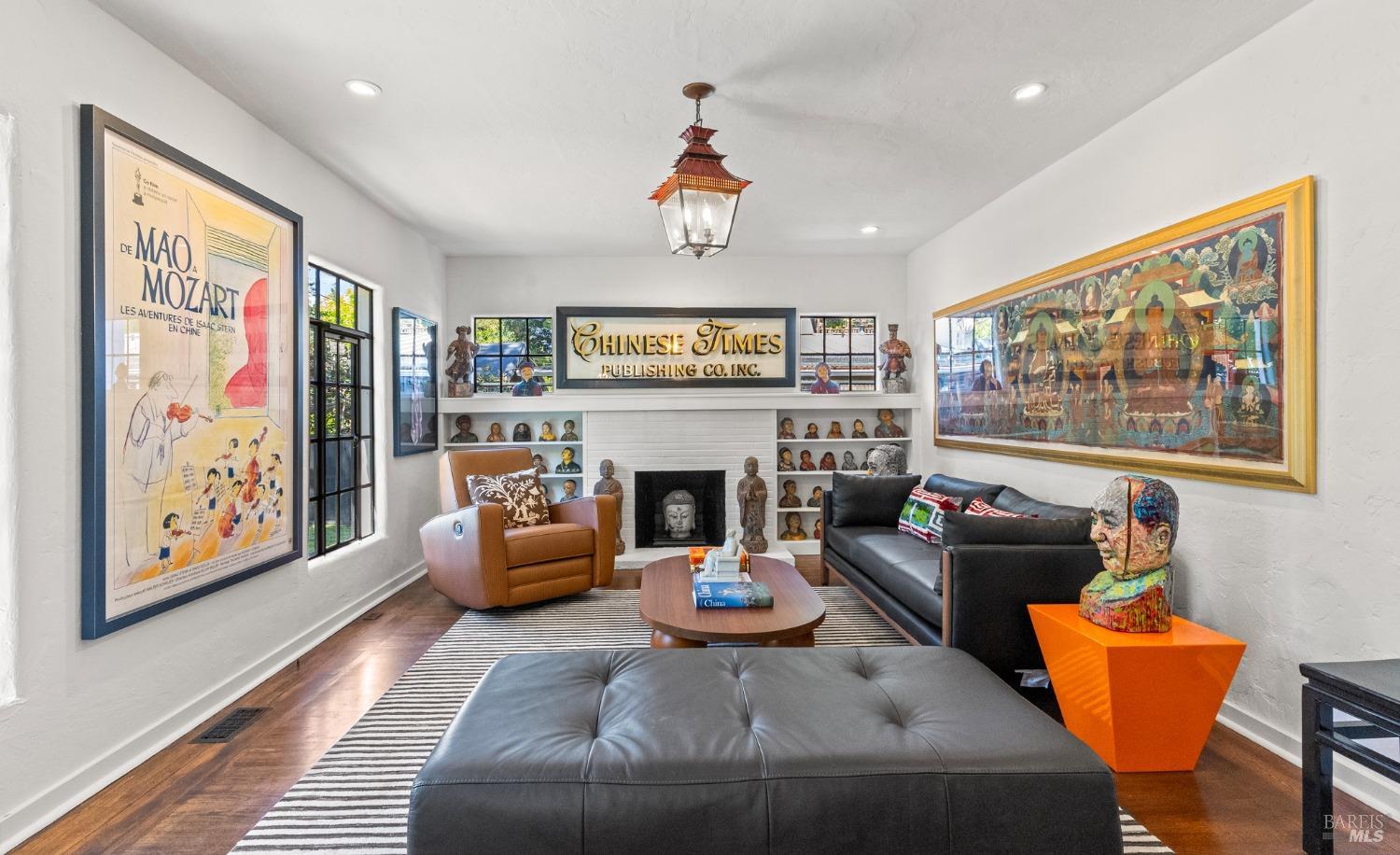 93 Cascade Drive Fairfax, CA 94930 - Photo 8 of 61 a living room with furniture a fireplace and a large window