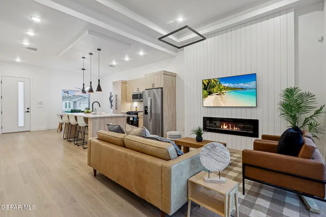a living room with furniture and a fireplace