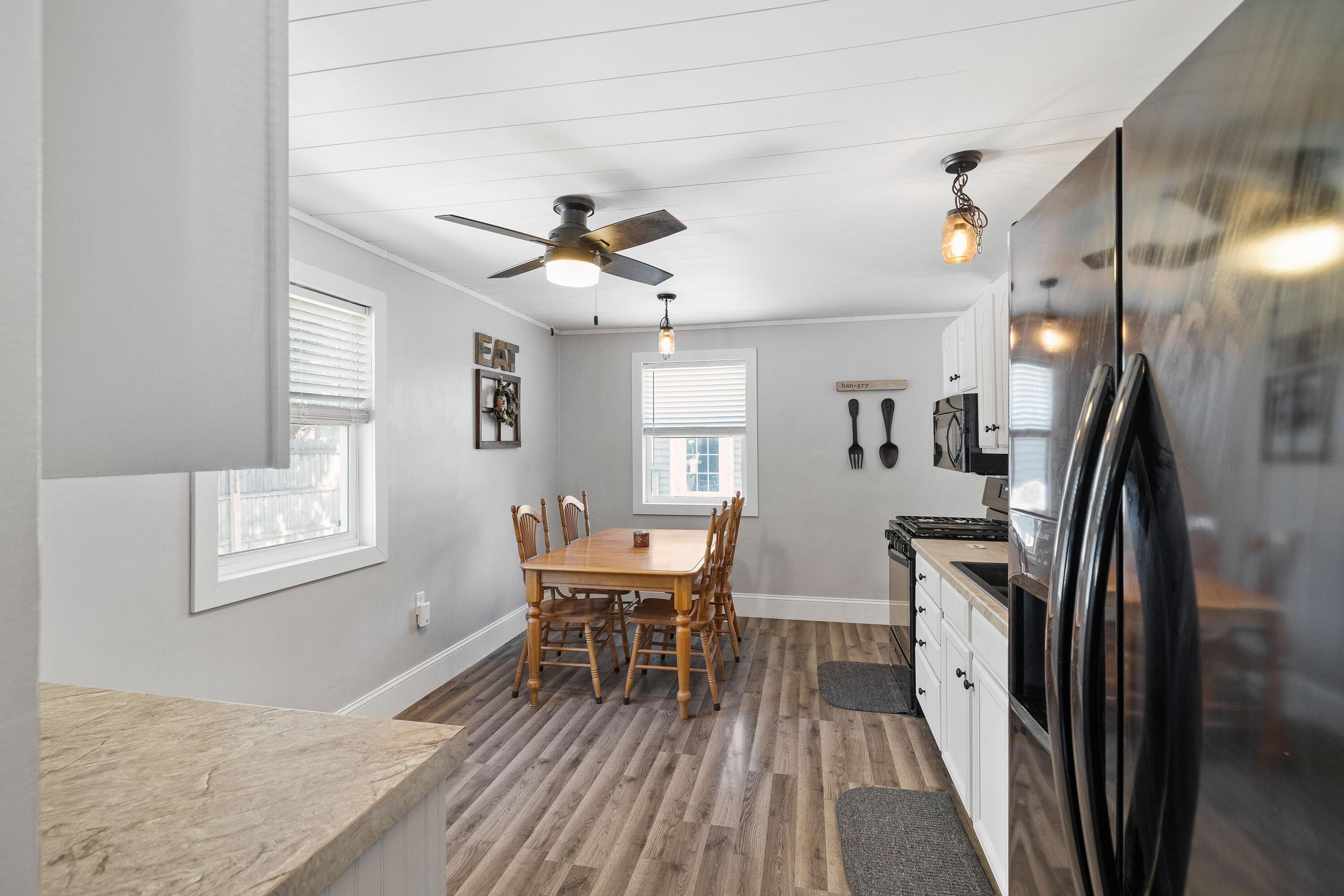 707-1 Imperial Road Valparaiso, IN 46385 - Photo 6 of 17 a view of a dining room with furniture and a chandelier