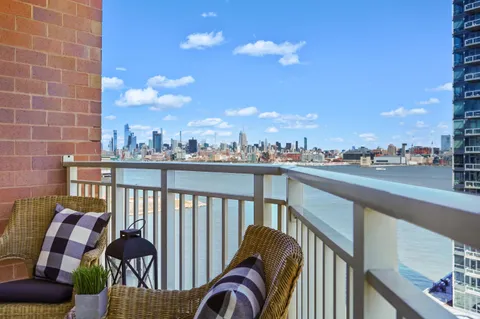 a view of a balcony with furniture