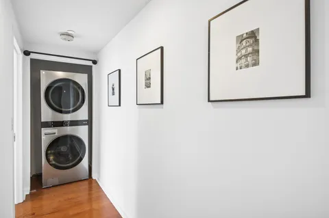 a view of a hallway with washer and dryer