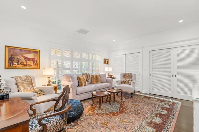 a living room with furniture and a rug