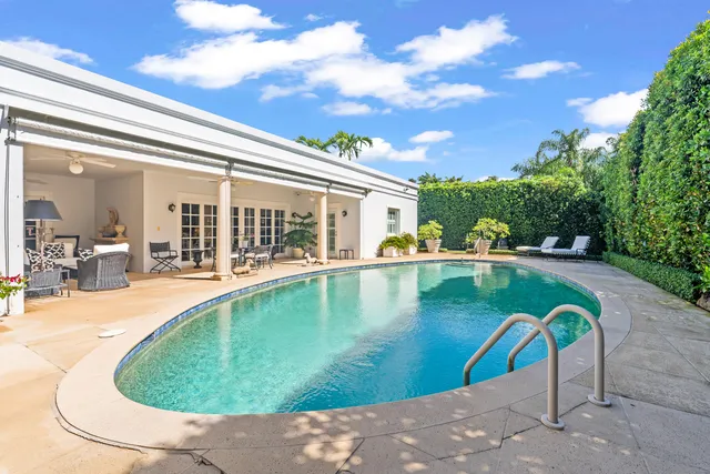 a view of a swimming pool with a patio