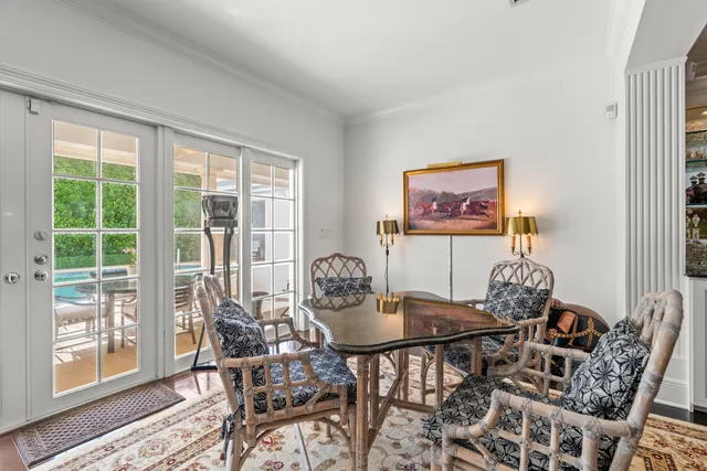 a dining room with furniture wooden floor and a rug
