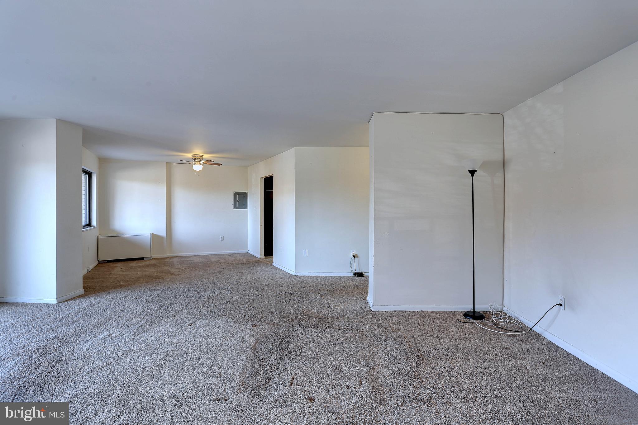 8830 Piney Branch Road, Unit 208 Silver Spring, MD 20903 - Photo 11 of 25 a view of a big room with closet and windows