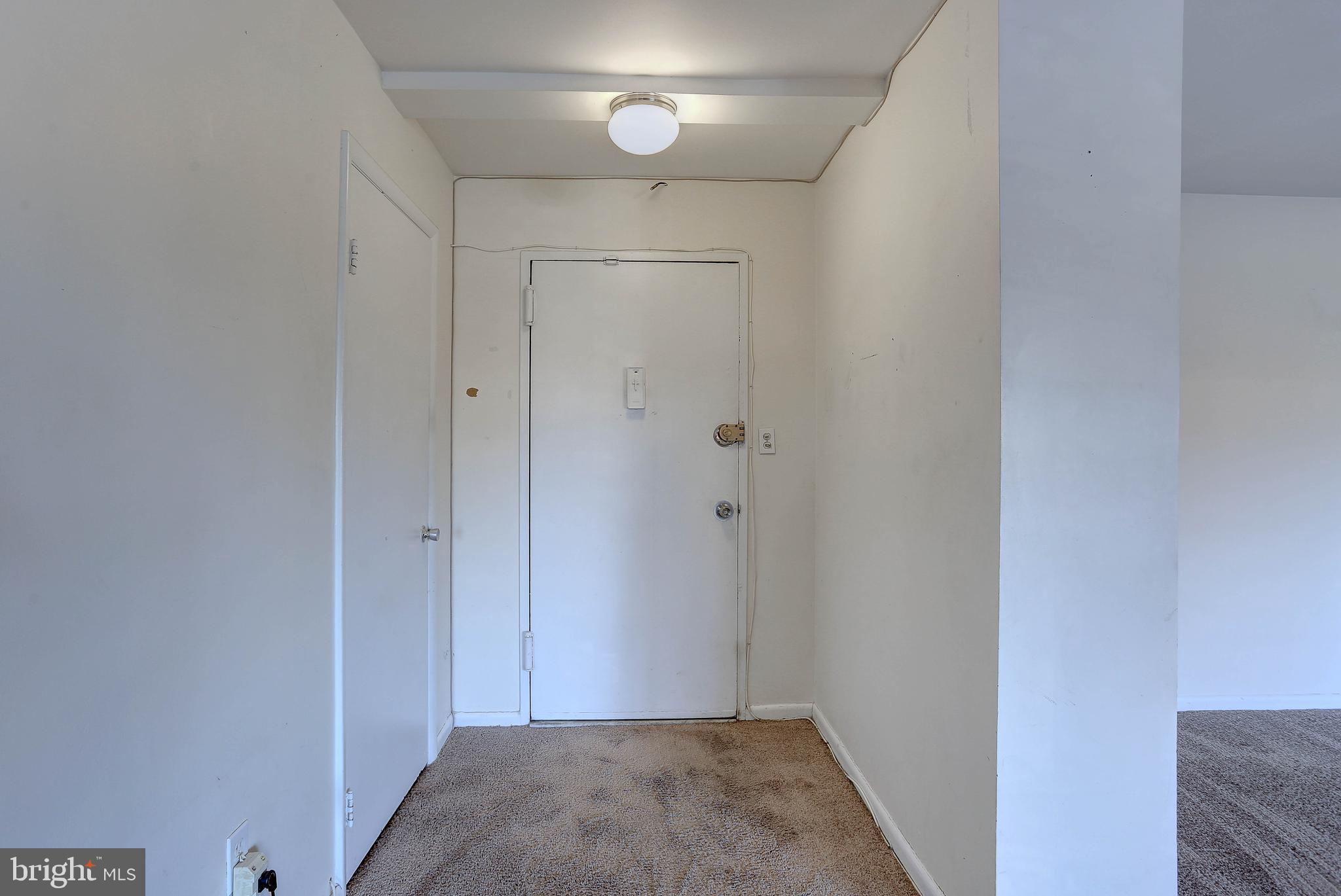 8830 Piney Branch Road, Unit 208 Silver Spring, MD 20903 - Photo 2 of 25 a view of hallway with closet