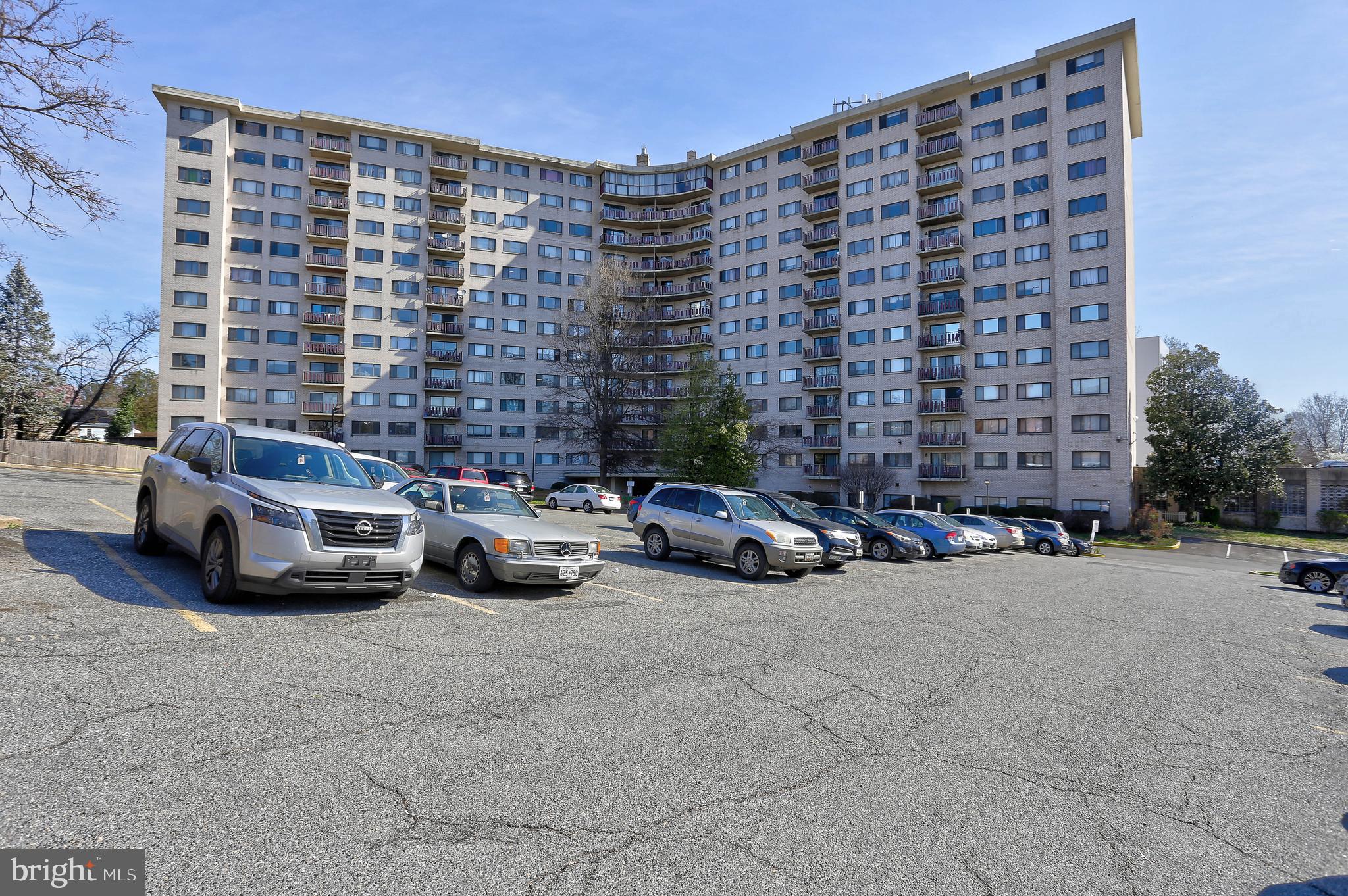 8830 Piney Branch Road, Unit 208 Silver Spring, MD 20903 - Photo 21 of 25 a view of cars parked in front of a building