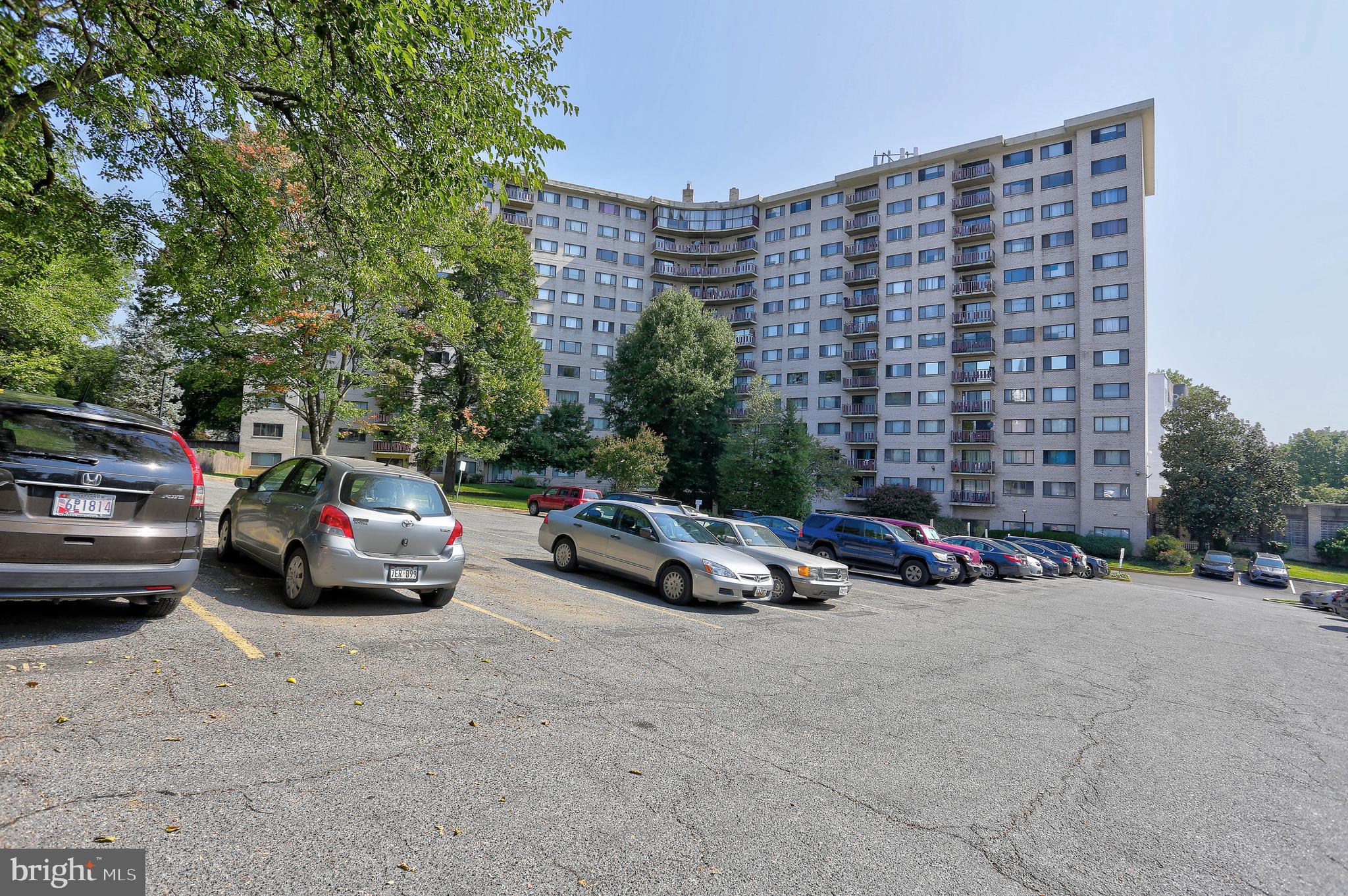 8830 Piney Branch Road, Unit 208 Silver Spring, MD 20903 - Photo 22 of 25 a view of street with parked cars