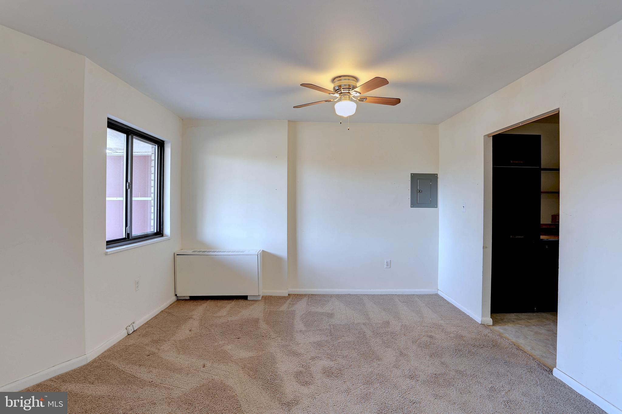 8830 Piney Branch Road, Unit 208 Silver Spring, MD 20903 - Photo 3 of 25 a view of empty room with window
