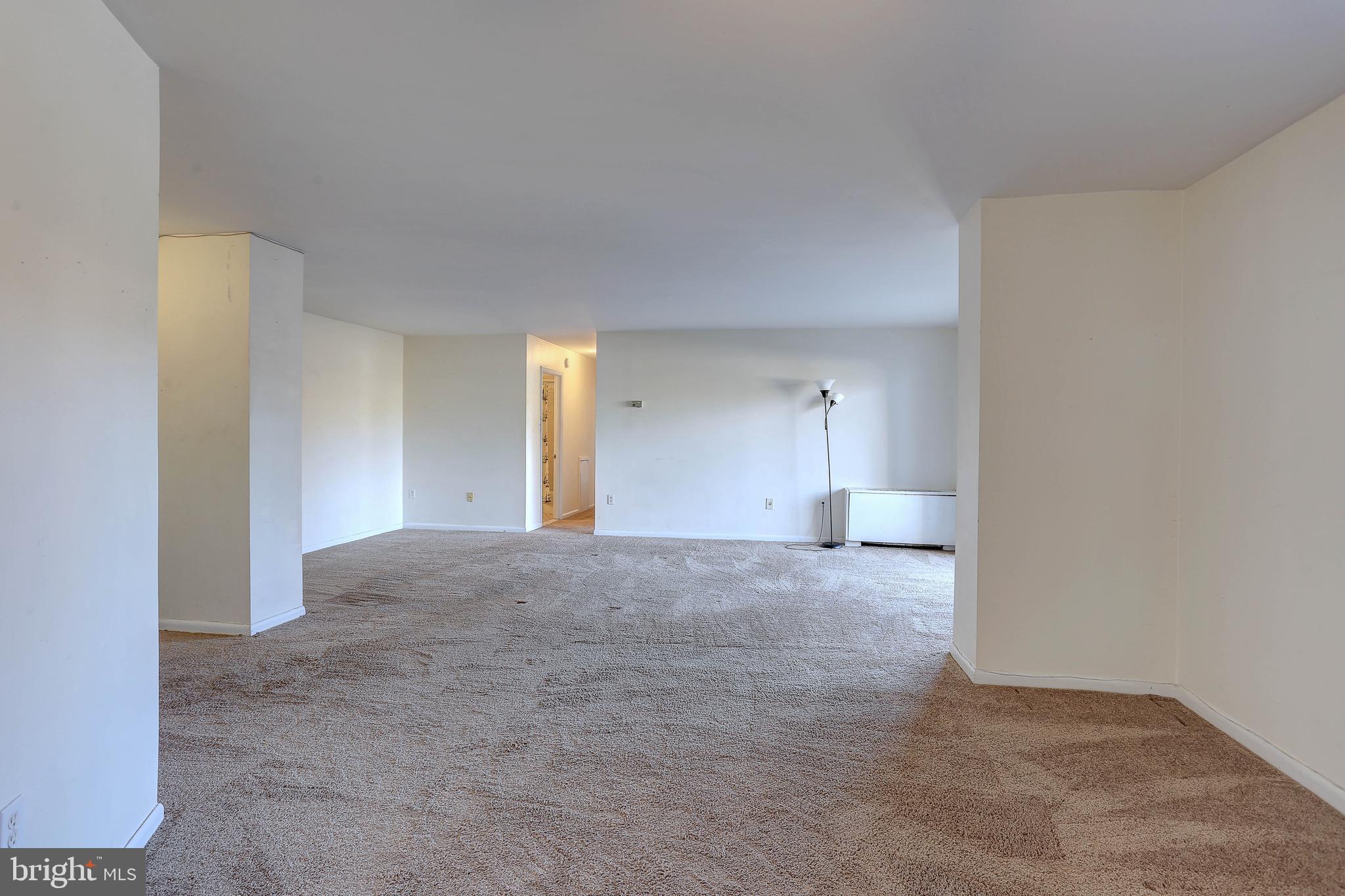 8830 Piney Branch Road, Unit 208 Silver Spring, MD 20903 - Photo 5 of 25 a view of an empty room and window