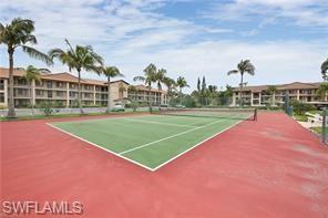 7380 St Ives Way, Unit 1204 Naples, FL 34104 - Photo 27 of 33 a view of a tennis court