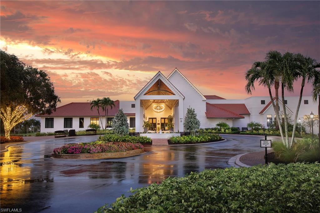7380 St Ives Way, Unit 1204 Naples, FL 34104 - Photo 29 of 33 a swimming pool view with plants and large trees