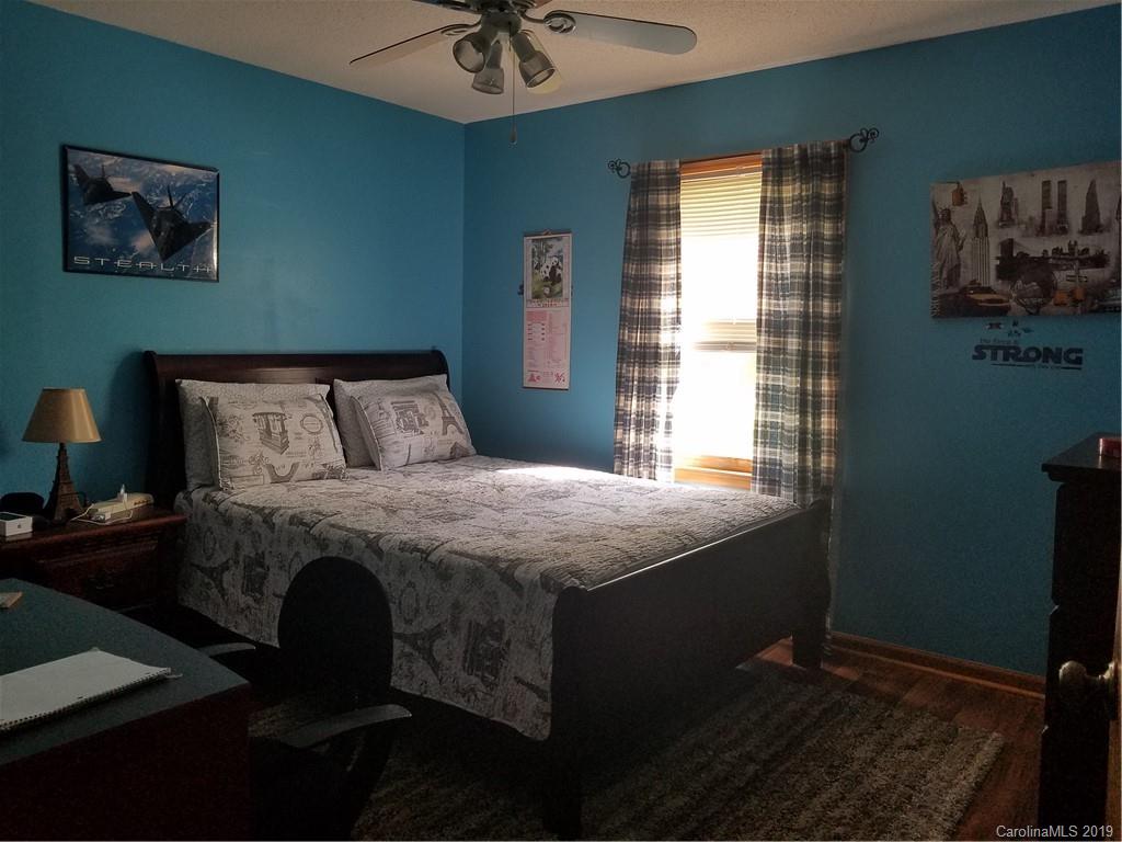 1313 Blacksnake Road Stanley, NC 28164 - Photo 11 of 17 a bedroom with a bed and a window