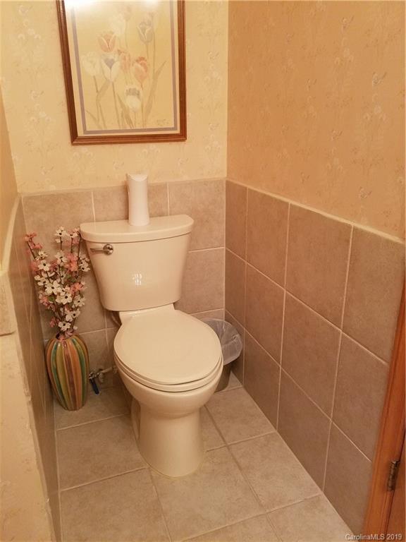 1313 Blacksnake Road Stanley, NC 28164 - Photo 13 of 17 a bathroom with a toilet and a shower