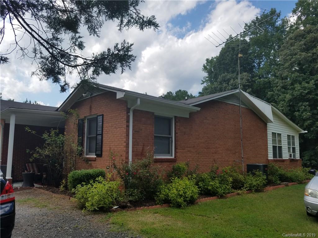 1313 Blacksnake Road Stanley, NC 28164 - Photo 4 of 17 a view of a house with a yard