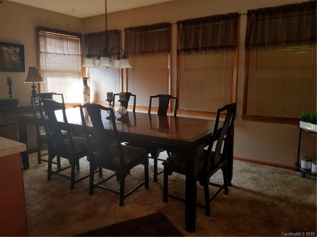 1313 Blacksnake Road Stanley, NC 28164 - Photo 9 of 17 a view of a dining room with furniture