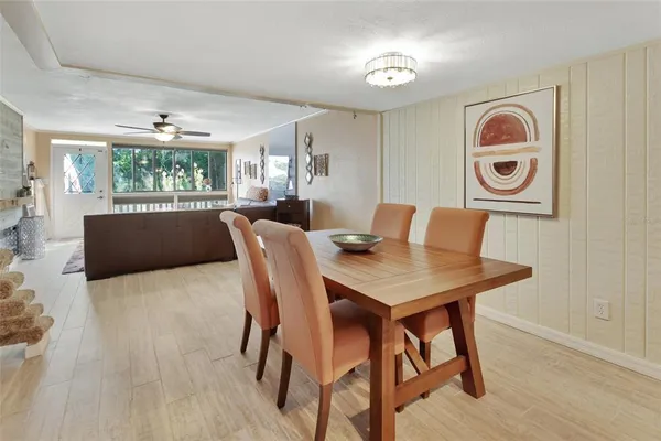 a view of a dining room with furniture window and wooden floor