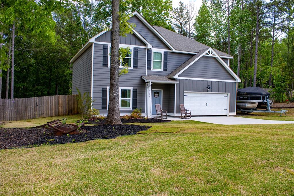 241 Randall Drive Carrollton, GA 30117 - Photo 1 of 1 a view of a house with backyard and swimming pool