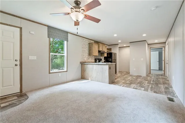 a view of a kitchen with a sink and a window
