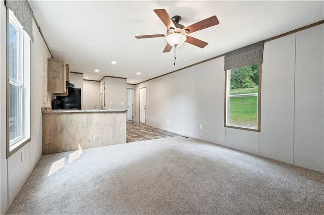 a view of a kitchen with a sink and a window