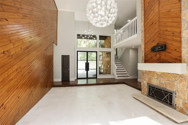 a view of an empty room with a fireplace