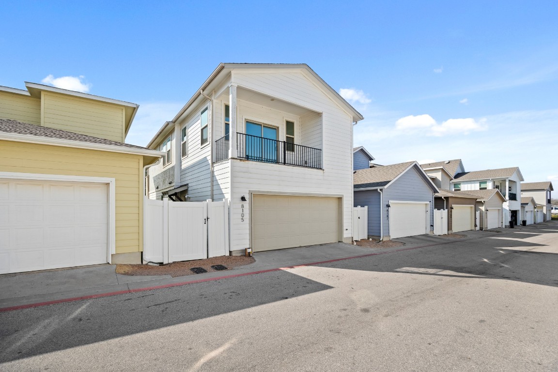 8105 Frida Bend Austin, TX 78744 - Photo 15 of 24 a front view of a house with a road