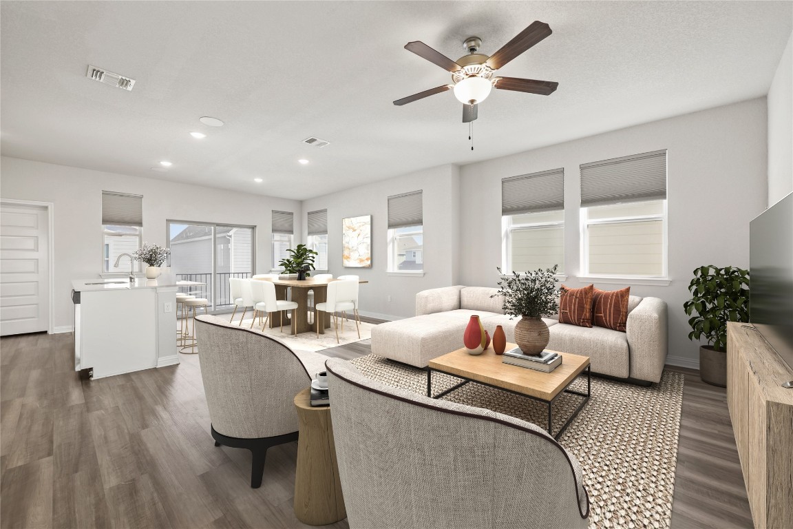 8105 Frida Bend Austin, TX 78744 - Photo 4 of 24 a living room with furniture and a large window with wooden floor