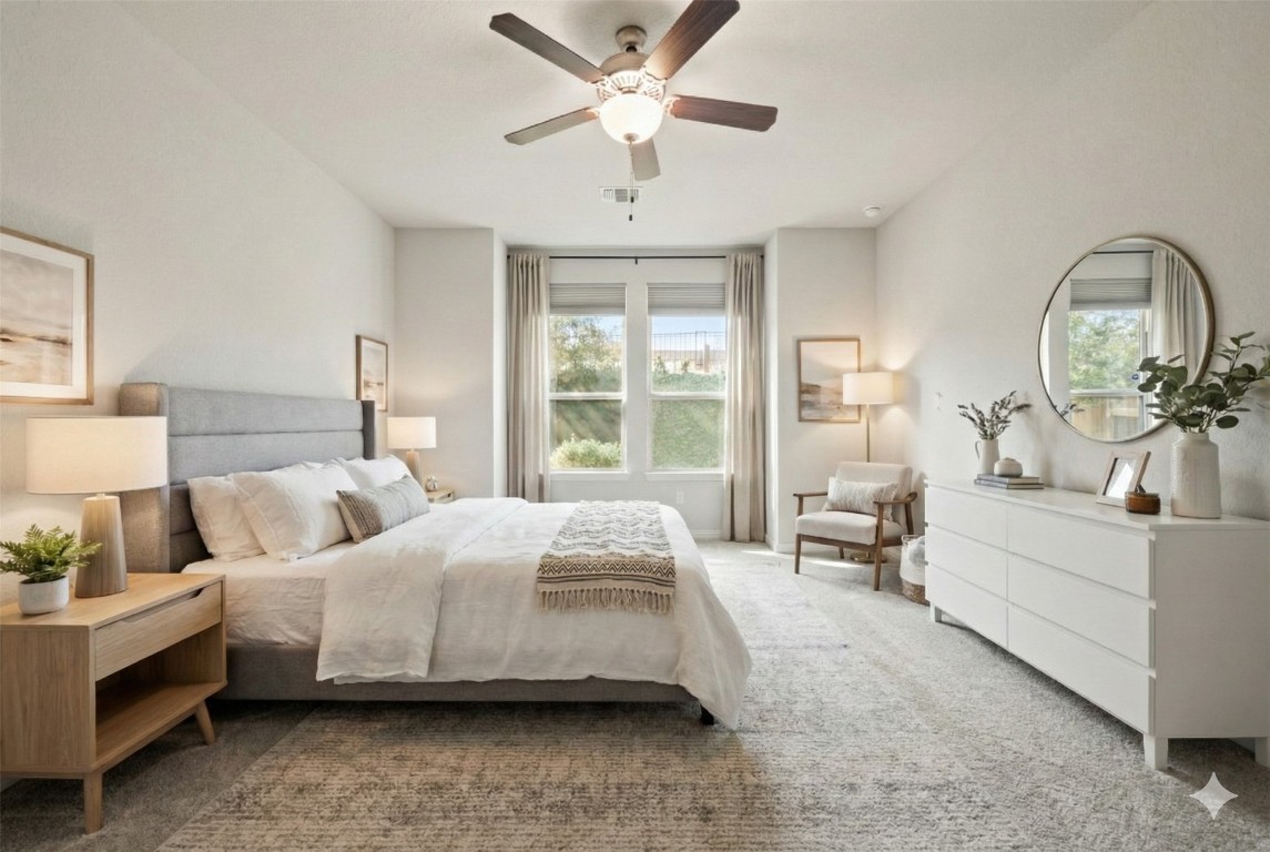 8105 Frida Bend Austin, TX 78744 - Photo 9 of 24 a bedroom with bed and a chandelier