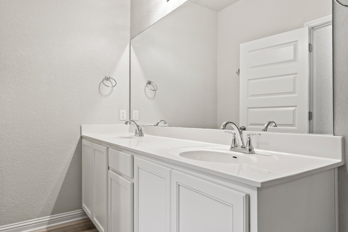 8105 Frida Bend Austin, TX 78744 - Photo 10 of 24 a bathroom with a sink and a mirror