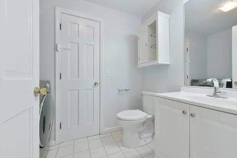 a bathroom with a sink toilet and vanity